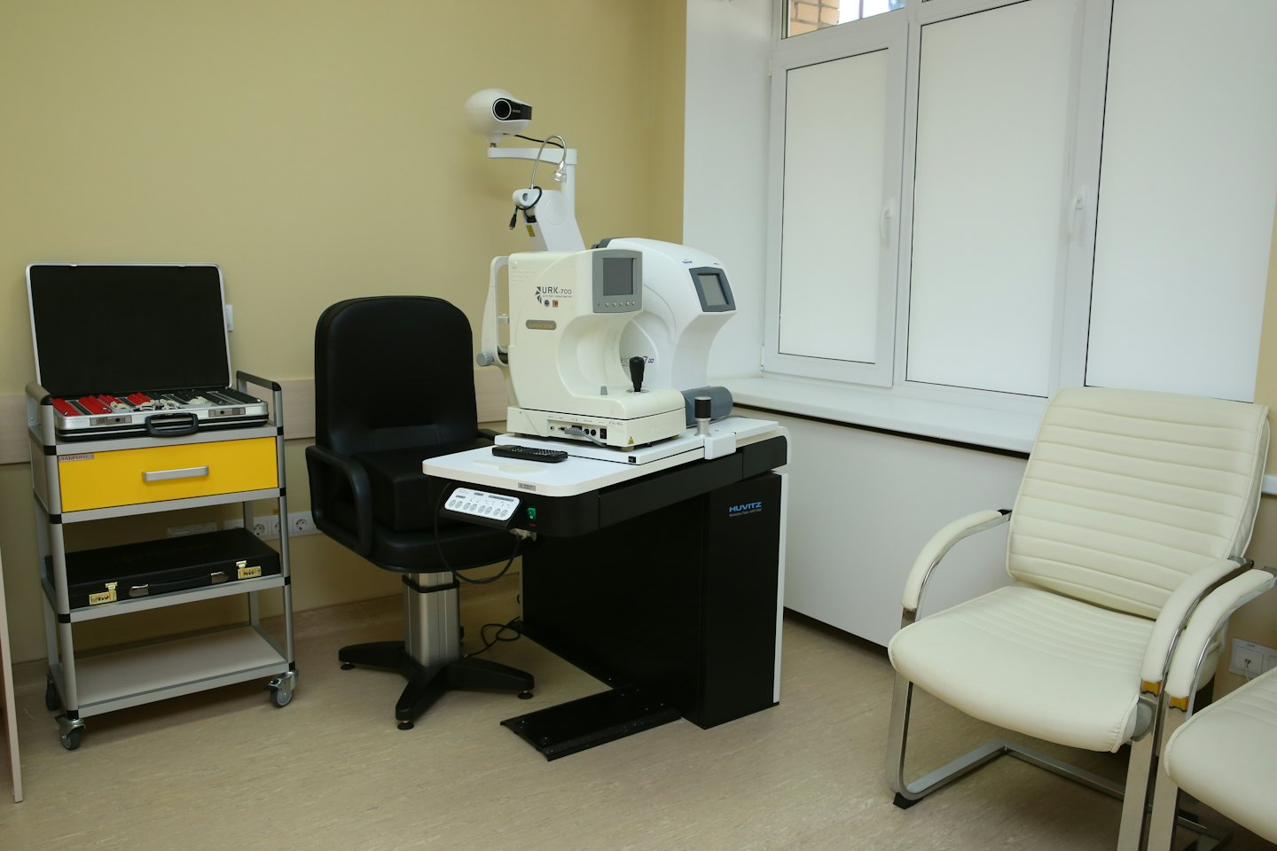 Optometry examination room with trial lenses and equipment.